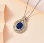 kyanite and white zircon pendant necklace in 18k yellow gold and rhodium over sterling silver shown in a lifestyle photo
