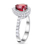 side view of pear ruby and white diamond halo ring in 950 platinum