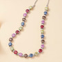 multi color moissanite necklace in rhodium over sterling silver shown in a lifestyle photo