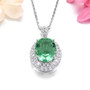 side view of oval green fluorite and white zircon halo pendant necklace in rhodium over sterling silver