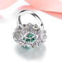 back view of green fluorite citrine blue topaz and zircon halo cocktail ring in rhodium over sterling silver