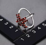 full view of garnet and white zircon ring in rhodium over sterling silver