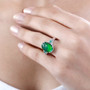 oval ammolite emerald and diamond ring in rhodium over sterling silver worn on a hand