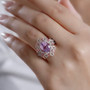 kunzite pink tourmaline and white zircon ring in 18k rose gold over sterling silver worn on a hand