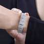 rainbow moonstone and white zircon bracelet in rhodium over sterling silver worn on a wrist