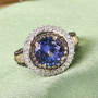 tanzanite champagne and white diamond ring in 14k yellow gold shown in a lifestyle photo