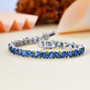 kyanite and chrome diopside tennis bracelet in rhodium over sterling silver shown in a lifestyle photo