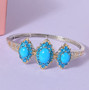 turquoise and neon apatite bangle bracelet in 18k yellow gold and rhodium over sterling silver shown in a lifestyle photo