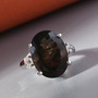 colombianite and white zircon ring in rhodium over sterling silver shown in a lifestyle photo