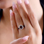 anthill garnet and moissanite double halo ring in 18k rose gold over sterling silver worn on a hand