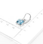 sky blue topaz dangle earrings in rhodium over sterling silver shown for size comparison
