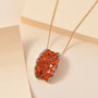fire opal and white zircon pendant necklace in 18k yellow gold over sterling silver shown in a lifestyle photo