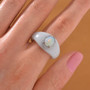ethiopian opal and white zircon halo rhodium over sterling silver carved white jade ring worn on a hand