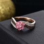 mahenge pink spinel brown and white zircon cluster ring in 18k rose gold and black and white rhodium over sterling silver shown in a lifestyle photo