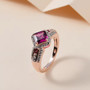 rhodolite garnet and white zircon ring in 18k rose gold over sterling silver shown in a lifestyle photo