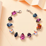 mix shape multi color mystic topaz station link bracelet shown in a lifestyle photo