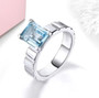 sky blue topaz solitaire ring in rhodium over sterling silver shown in a lifestyle photo