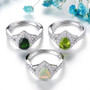 close up of ethiopian opal and white zircon halo ring in rhodium over sterling silver