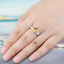 citrine and white zircon ring in rhodium over sterling silver worn on a hand