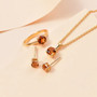 6mm round citrine jewelry set in 18k yellow gold over sterling silver shown in a lifestyle photo