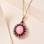 pink opal rhodolite garnet and zircon halo pendant necklace in 18k rose gold over sterling silver shown in a lifestyle photo