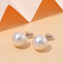 9-11mm round white edison pearl stud earrings in rhodium over sterling silver shown in a lifestyle photo