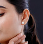 9-11mm round white edison pearl stud earrings in rhodium over sterling silver worn on the ear