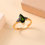 marquise chrome diopside and brown diamond accent ring in 18k yellow gold over sterling silver shown in a lifestyle photo