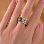 18k yellow gold and rhodium over sterling silver openwork eternity band ring 4 25g worn on a hand