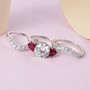 moissanite and ruby three ring set in rhodium over sterling silver shown in a lifestyle photo