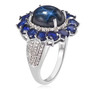 side view of blue star sapphire sapphire and zircon halo ring in rhodium over sterling silver