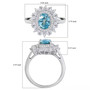 oval blue zircon and white zircon double halo ring in rhodium over sterling silver shown for size comparison