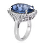 side view of oval color change fluorite and white zircon halo ring in rhodium over sterling silver