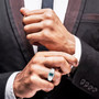 indicolite tourmaline and diamond emerald cut halo gents ring in solid 14k white gold worn on a hand