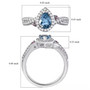 aquamarine pink sapphire and white zircon infinity shank halo ring in rhodium over sterling silver shown for size comparison