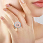 morganite diamond and aquamarine double halo ring in 14k rose gold worn on a hand