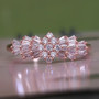 natural pink diamond cluster ring in solid 10k rose gold shown in a lifestyle photo