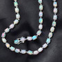 ethiopian opal oval tennis necklace in rhodium over sterling silver shown in a lifestyle photo