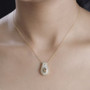 golden tanzanite yellow sapphire and zircon pendant necklace in 18k yellow gold over sterling silver worn around the neck