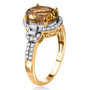 side view of golden tanzanite and diamond halo ring in solid 14k yellow gold