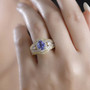 tanzanite yellow sapphire and zircon ring in 18k yellow gold over sterling silver worn on a hand
