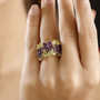 amethyst and peridot flower cluster ring in rhodium over sterling silver worn on a hand