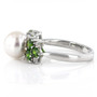 side view of white freshwater pearl chrome diopside and zircon ring in rhodium over sterling silver