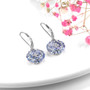full view of tanzanite and white zircon dangle earrings in rhodium over sterling silver