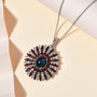 blue star sapphire brown zircon and white zircon pendant necklace in rhodium over sterling silver shown in a lifestyle photo