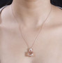 morganite padparadscha sapphire and diamond pendant necklace in solid 14k rose gold worn around the neck