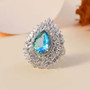 blue and green quartz triplet and moissanite ring in rhodium over sterling silver shown in a lifestyle photo