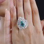 blue and green quartz triplet and moissanite ring in rhodium over sterling silver worn on a hand
