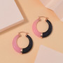 black and pink jade hoop earrings in 18k rose gold over sterling silver shown in a lifestyle photo