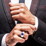 trillion tanzanite and diamond halo gents ring in 950 platinum worn on a hand